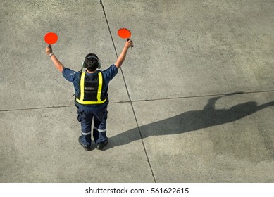 Airport Worker Directing