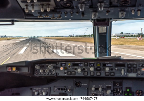 Airports\
runway as seen from the cockpit as\
Landing