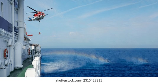     Air-sea rescue operations. Red rescue helicopter and Oil Tanker Ship . rescue team. The Coast security. The accident on the water. Ship have Emergency Accident. Training air sea recue operations.  - Shutterstock ID 2315428311