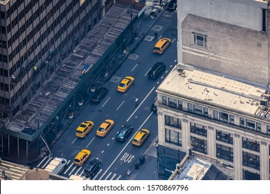 Airstrip of New York City, with buildings and streets filled with the famous yellow taxis during the day. Concept of travel and transport. NYC, USA. - Shutterstock ID 1570869796