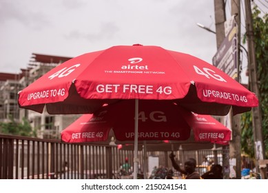 An Airtel Umbrella Used By Vendors Outside University Of Lagos Gates - Lagos, NIGERIA, March 22 2022. NIgerian Economy Amidst Rising Inflation