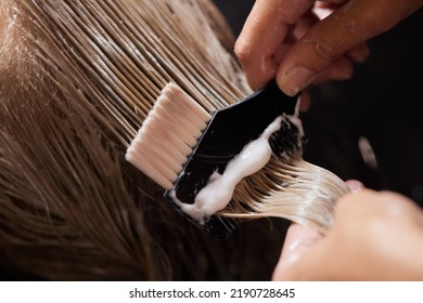 Airtouch Hair stylist makes bouffant using comb on thin strands. Shatush technique for hair lightening. - Powered by Shutterstock