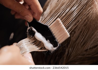 Airtouch Hair stylist makes bouffant using comb on thin strands. Shatush technique for hair lightening. - Powered by Shutterstock