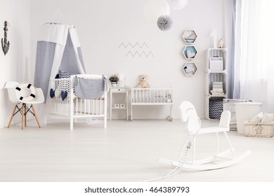 Airy Baby Room Agganged In White And Navy Blue, With Marine Decorations