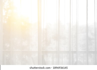 airy or thin and transparent white curtain with texture for see through and soft light on balcony window and close in room for home or hotel interior decor on morning warm sunlight for background - Shutterstock ID 1896936145