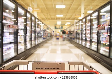 An Aisle In A Grocery Store Showing Frozen Foods