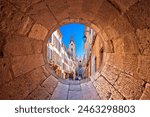 Aix En Provence scenic alley and church view through stone window, southern France