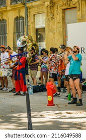Aix-en-Provence, France - August 2021 : Fanfare of street musicians playing jazz on the Cours Mirabeau in Aix en Provence a day of summer