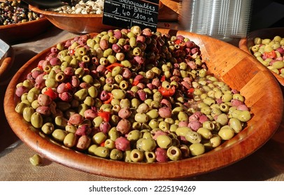 Ajaccio, Corsica, France, October 30, 2022. Mediterranean Culture And Colour In Island Capital City Or Town. Produce Or Organic Food In Artisan Food Market. Wooden Bowls Of Olives. Sunny Day Outdoors