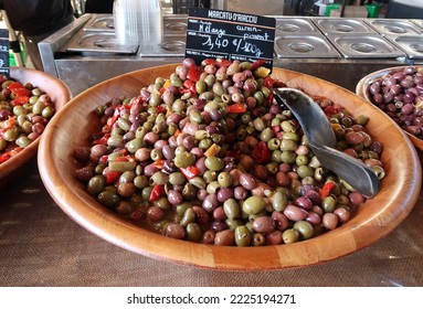 Ajaccio, Corsica, France, October 30, 2022. Mediterranean Culture And Colour In Island Capital City Or Town. Produce Or Organic Food In Artisan Food Market. Wooden Bowls Of Olives. Sunny Day Outdoors