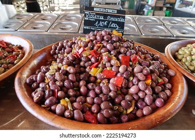 Ajaccio, Corsica, France, October 30, 2022. Mediterranean Culture And Colour In Island Capital City Or Town. Produce Or Organic Food In Artisan Food Market. Wooden Bowls Of Olives. Sunny Day Outdoors