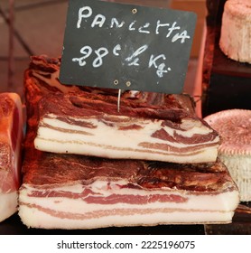 Ajaccio, Corsica, France, October 30, 2022. Mediterranean Culture And Colour In Island Capital City Or Town. Produce Or Organic Food In Artisan Food Market. Pancetta Bacon. Sunny Day Outdoors