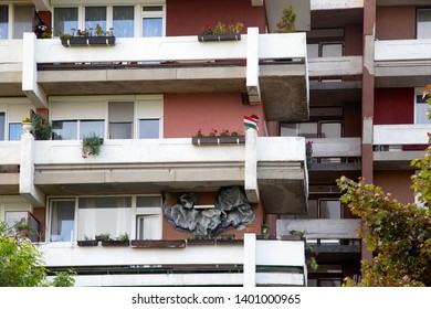 AJKA,HUNGARY – MAY 17. 2019 : Decorated Housing Estate Balconies With Flowers,flags,and Reliefs.