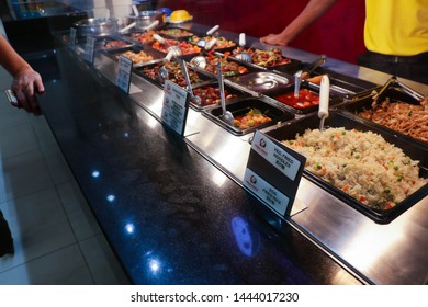 Ajman, UAE - 7/3/19: Panda Express.  Ordering Chinese Fast Food In A Mall Food Court