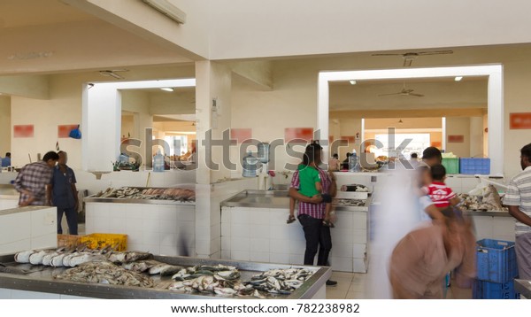 AJMAN,
UAE - SEPTEMBER 2016: Fish market in the emirate of Ajman timelapse
with people selling fish. United Arab Emirates 
