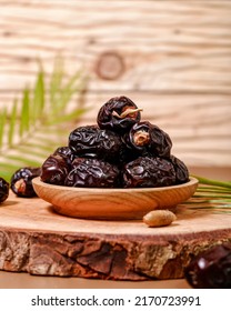 Ajwa dates from Medina on a wooden background