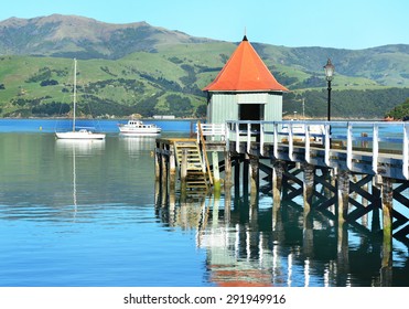 AKAROA, NEW ZEALAND -NOV24: Jetty Pier Of Akaroa On NOV24, 2014 In Akaroa, NZ. Akaroa Is A Historic French And British Settlement Nestled In The Heart Of An Ancient Volcano On Banks Peninsula, NZ.