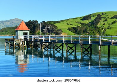 AKAROA, NEW ZEALAND -NOV24: Jetty Pier Of Akaroa On NOV24, 2014 In Akaroa, NZ. Akaroa Is A Historic French And British Settlement Nestled In The Heart Of An Ancient Volcano On Banks Peninsula, NZ.