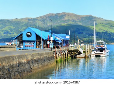 AKAROA, NEW ZEALAND -NOV24: Pier Of Akaroa On NOV24, 2014 In Akaroa, NZ. Akaroa Is A Historic French And British Settlement Nestled In The Heart Of An Ancient Volcano On Banks Peninsula, NZ.