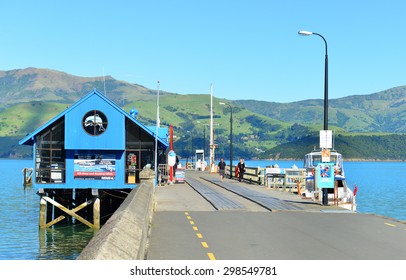 AKAROA, NEW ZEALAND -NOV24: Pier Of Akaroa On NOV24, 2014 In Akaroa, NZ. Akaroa Is A Historic French And British Settlement Nestled In The Heart Of An Ancient Volcano On Banks Peninsula, NZ.