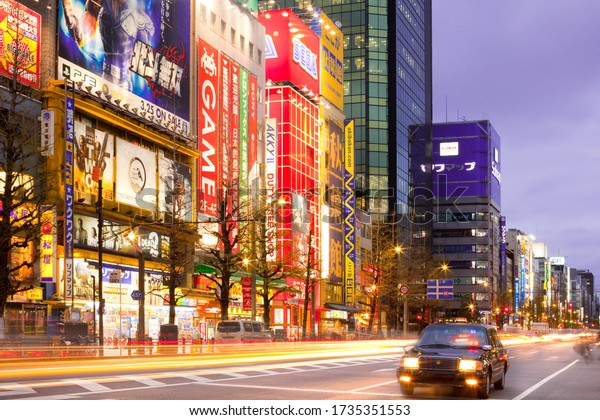 Akihabara
Electric Town, Tokyo, Kanto Region, Honshu, Japan - Advertising
billboards and traffic and light trails at the bustling
neighborhood of Akihabara Electric
Town.