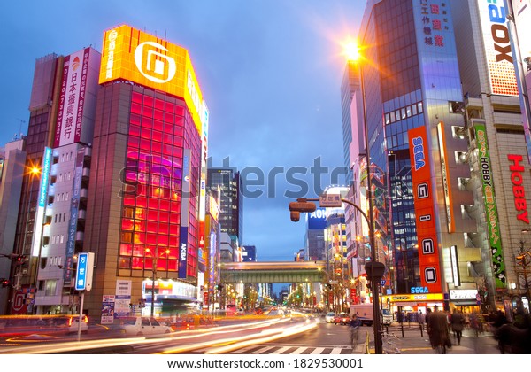 Akihabara\
Electric Town, Tokyo, Kanto Region, Honshu, Japan - Advertising\
billboards and traffic and light trails at the bustling\
neighborhood of Akihabara Electric\
Town.