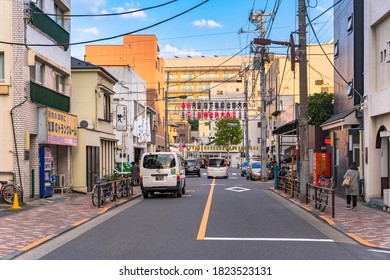 Akihabara, Japan - November 08 2019: Street Decorated With Japanese Paper Lanterns Announcing On The Upper The Enthronement Of The New Emperor Naruhito And On The Lowest The Annual Tori-no-Ichi Fair.