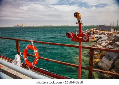 Aktau, Kazakhstan - May 19 2012: Caspian Sea, Gas Loading Terminal. Fire Sensor. Blue Water And Seaport On Background.