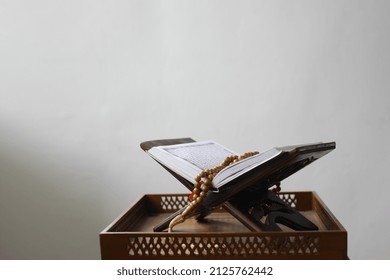 Al Quran On Table Isolated On White Background. Islamic Concept. Indonesia February 2022