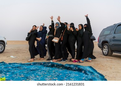 Al Shuaiba, Saudi Arabia - March 19 2021 - Group Of Young Saudi Young Women Enjoying Life And Having Fun At Sunset At The Beach