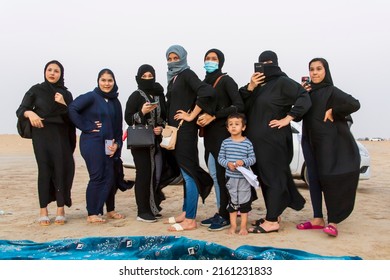 Al Shuaiba, Saudi Arabia - March 19 2021 - Group Of Young Saudi Young Women Enjoying Life And Having Fun At Sunset At The Beach