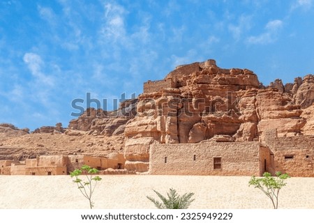 Al Ula old town street with castle walls on the hill, Medina province, Saudi Arabia