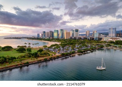 Ala Moana Beach Park and Magic Island, with Kakaako skyline of Honolulu  at sunset