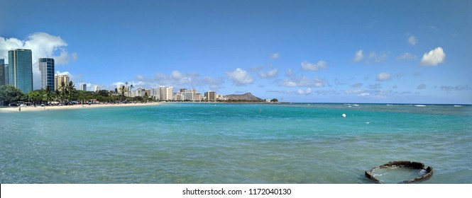 Ala Moana Beach Park with office building and condos in the background during a beautiful day on the island of Oahu, Hawaii. 2018