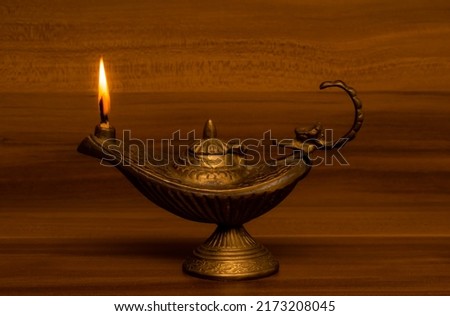 Aladdin lamp with a flame