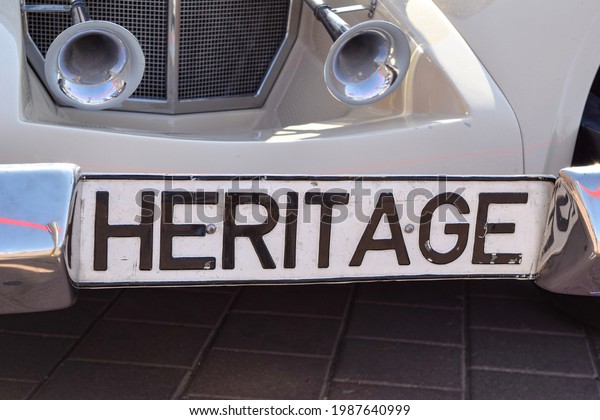 Al-Ain City, UAE - December 3, 2015:\
Classic vehicle license plate, a vintage car\
horn.