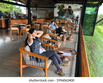 Alajuela, Costa Rica- Cerca 2021: Tour Inside Alsacia Starbucks Coffee Farm. Tourists Taking Some Coffee At Its Cafeteria