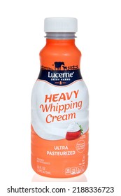 Alameda, CA - August 8, 2022: One Bottle Of Lucerne Dairy Farms Brand Heavy Whipping Cream, Isolated On White With Slight Reflection On Table.