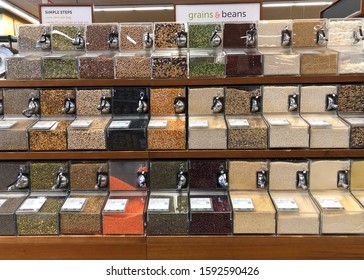 Alameda, CA - Dec 18, 2019: Grocery Store Aisle With Self Serve Bins Containing Various Grains And Beans. Scoop And Weigh Out Exactly How Much You Want And Self Tag For Scanning At The Register.