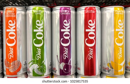 Alameda, CA - February 09, 2018: Grocery Store shelf with cans of flavored Diet Coke. Ginger Lime, Feisty Cherry, Zesty Blood Orange and Twisted Mango bring more variety to the trademark coke brand.