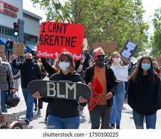 Alameda, CA - June 5, 2020: Protestors Participating In  The George Floyd Black Lives Matter Protest In Alameda, Marching From Encinal High School To City Hall For A Rally.