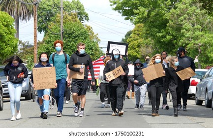 Alameda, CA - June 5, 2020: Protestors Participating In  The George Floyd Black Lives Matter Protest In Alameda, Marching From Encinal High School To City Hall For A Rally.