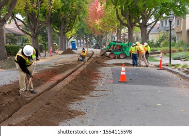 Alameda, CA - Nov 07, 2019: Crews Cutting A Ditch In The Middle Of A Residential Street To Underground Lines For Street Lights. Undergrounding Is Critical In High Fire Risk Areas.