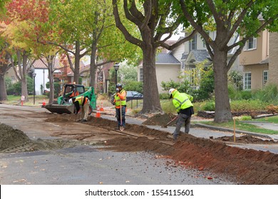 Alameda, CA - Nov 07, 2019: Crews Cutting A Ditch In The Middle Of A Residential Street To Underground Lines For Street Lights. Undergrounding Is Critical In High Fire Risk Areas.