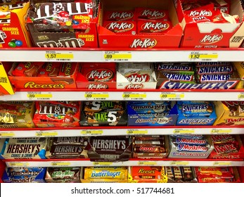 Alameda, CA - November 17, 2016: Many candy bars in a display in the check out line at the grocery store, placed in a highly visible place where you will see it to potentiate impulse purchases.