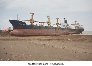 Alang, India, September 2008. Large Tonnage Cargo Ship Stranded On The Beach Waiting To Be Scrapped.