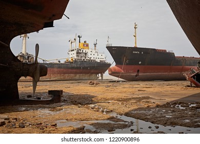 Alang, India, September 2008. Large Tonnage Cargo Ships Stranded On The Beach Waiting To Be Scrapped.