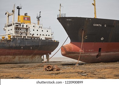 Alang, India, September 2008. Large Tonnage Cargo Ships Stranded On The Beach Waiting To Be Scrapped.