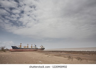 Alang, India, September 2008. Large Tonnage Cargo Ship Stranded On The Beach Waiting To Be Scrapped.