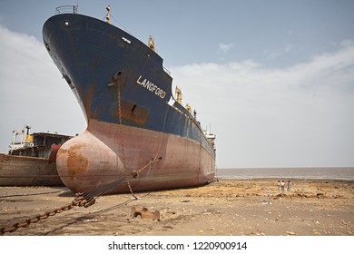 Alang, India, September 2008. Large Tonnage Cargo Ship Stranded On The Beach Waiting To Be Scrapped.